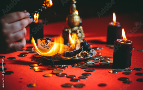 a witch holds a ritual for money