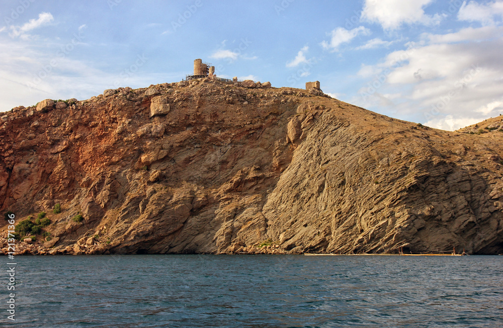 blue sea and sand mountains on wild rocky crimean coast and old blue sea and sand mountains on wild rocky crimean coast and old