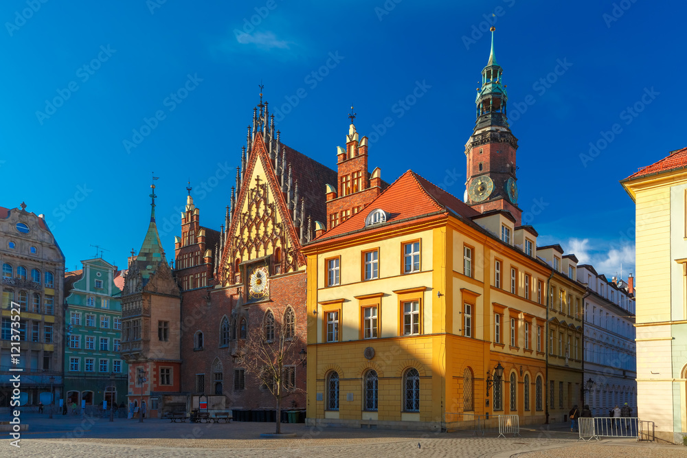 City hall and colorful houses on Market Square in the winter sunny morning in Wroclaw, Poland