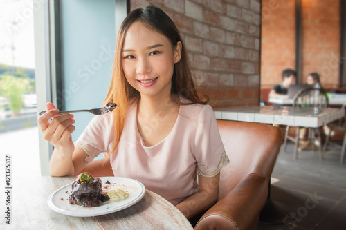 Beautiful asia woman enjoy eating.