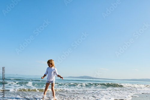 boy having Fun in the sea waves