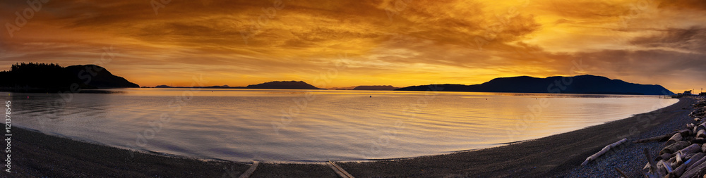 San Juan Islands Sunset. A beautiful winter sunset from Legoe Bay on Lummi Island looking west towards Orcas Island in the San Juan archipelago in western Washington state.