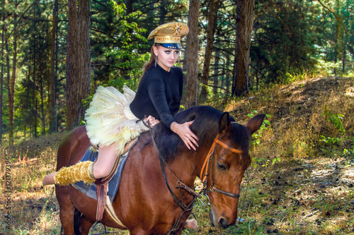 beautiful girl in uniform on horseback © Vadim Hnidash