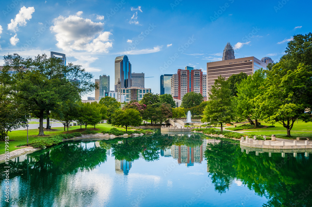 The skyline of Uptown Charlotte, and lake at Marshall Park, in U