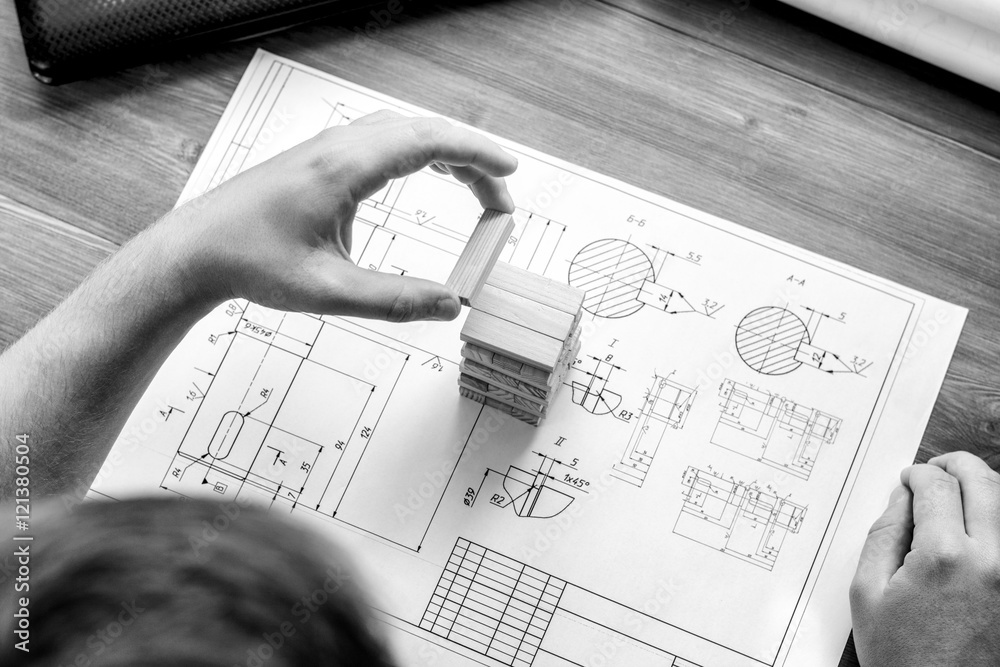 Architect working on blueprint. Architects workplace architectural