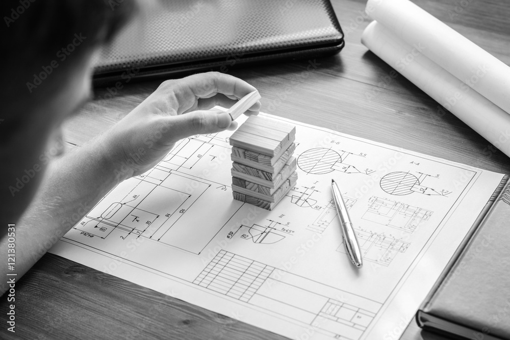 Architect working on blueprint. Architects workplace architectural