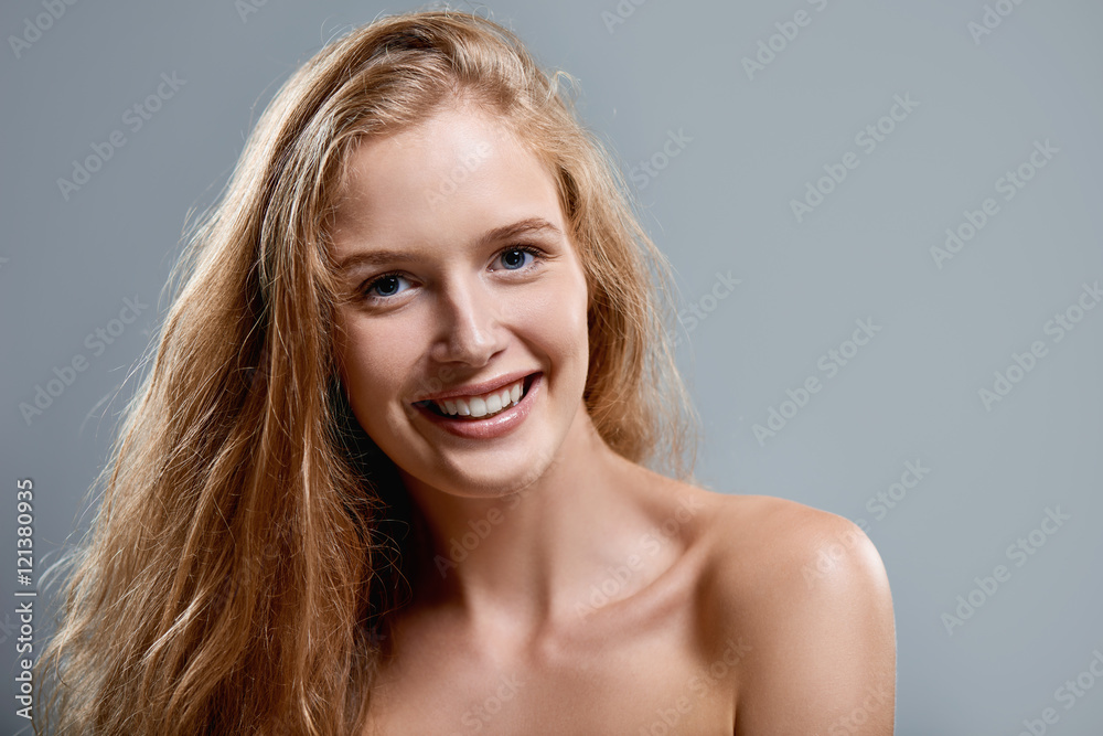 Closeup of woman playfully winking at camera Closeup of woman playfully winking at camera