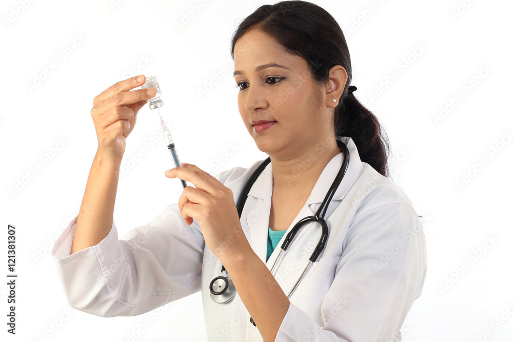 Young doctor woman with syringe against white background Young doctor woman with syringe against white background