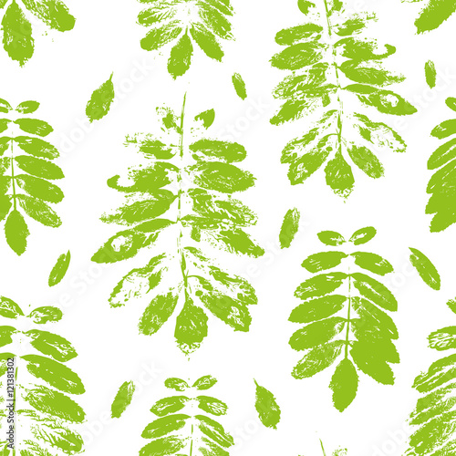 Seamless pattern with paint prints of rowan leaves