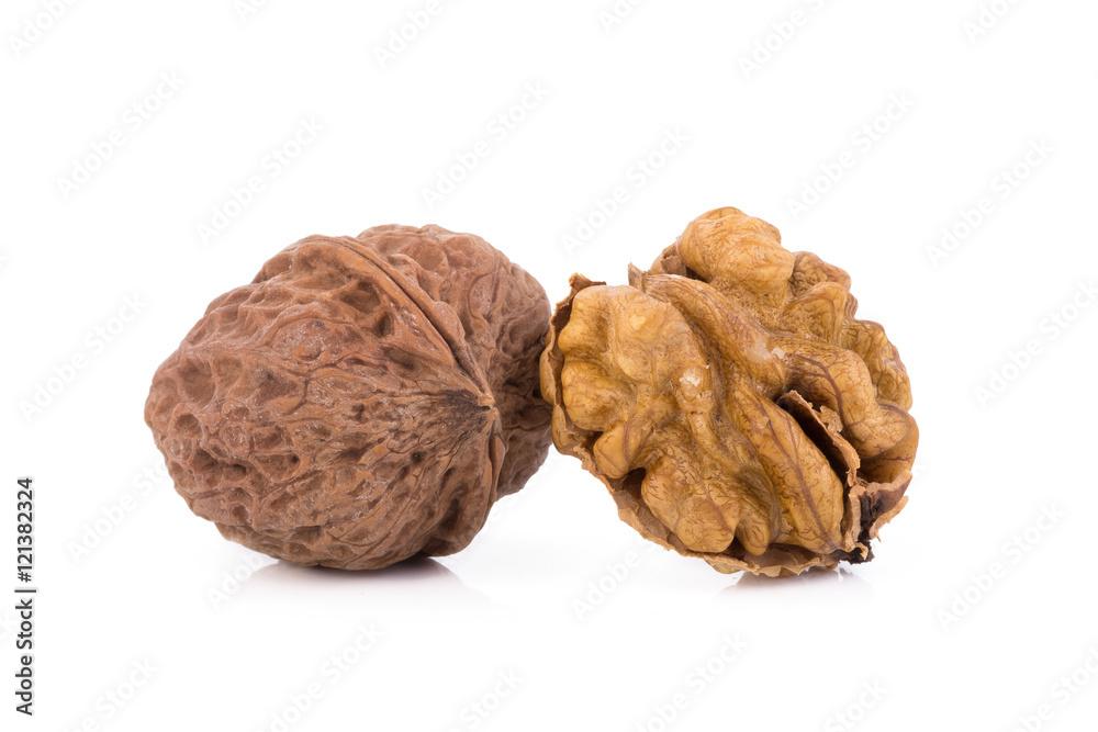 walnut and a cracked walnut isolated on the white background walnut and a cracked walnut isolated on the white background