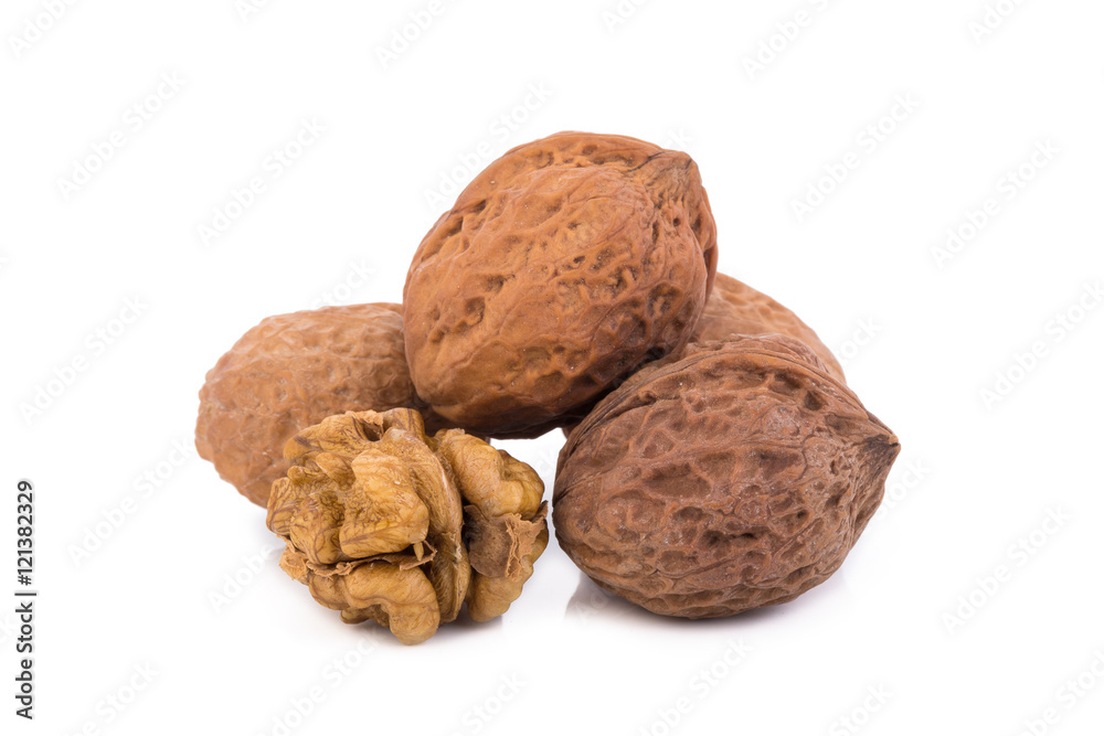 walnut and a cracked walnut isolated on the white background walnut and a cracked walnut isolated on the white background