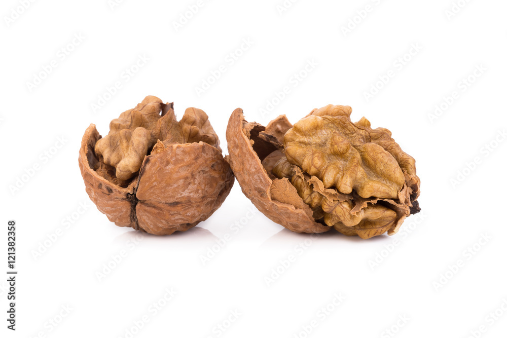 walnut and a cracked walnut isolated on the white background walnut and a cracked walnut isolated on the white background