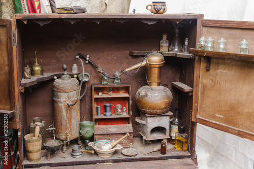 Photos recreation of an old brass alembic for the production of alcoholic beverages
