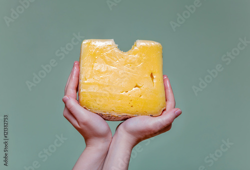 Two arms holding cheese