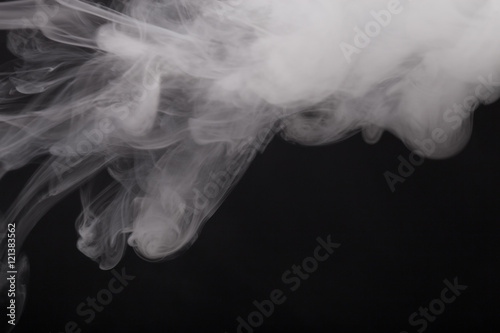 Cloud of smoke on black background. Selective focus