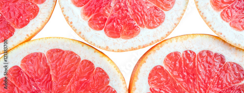 Panoramic bright and fresh lemon, orange, grapefruit for skinali. Colorful citrus fruit slices background. White backside.