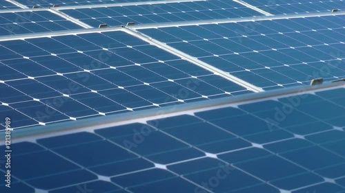 crane shot of a solar panel array on a rooftop