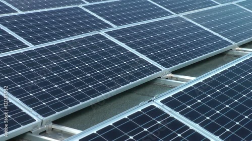 crane shot of a solar panel array on a rooftop