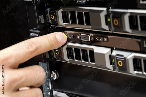 Engineer's Finger Switching On Server At Data Center