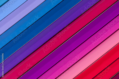 Background of parallel colorful pencils, slant, close up