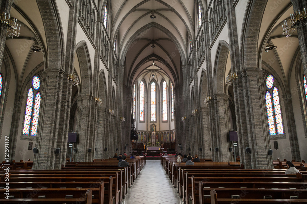 Fototapeta premium Inside the Myeongdong Cathedral (also known as Cathedral Church of the Virgin Mary of the Immaculate Conception) in Seoul, South Korea.