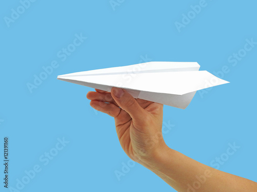 Paper plane in woman hand.