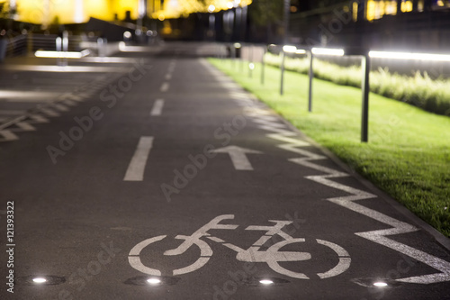 The bicycle sign on the grey road in the public park for biking