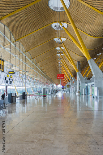 Madrid, Spain: 16th June 2016: The Madrid-Barajas Airport is Spain's largest and busiest airport, characterised by a floating roof propped by an internal coloured structure.