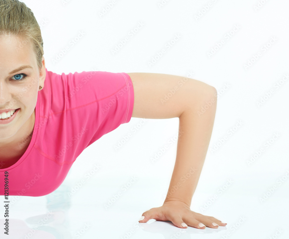 Woman warming up before workout in studio isolated on white background. Woman warming up before workout in studio isolated on white background.