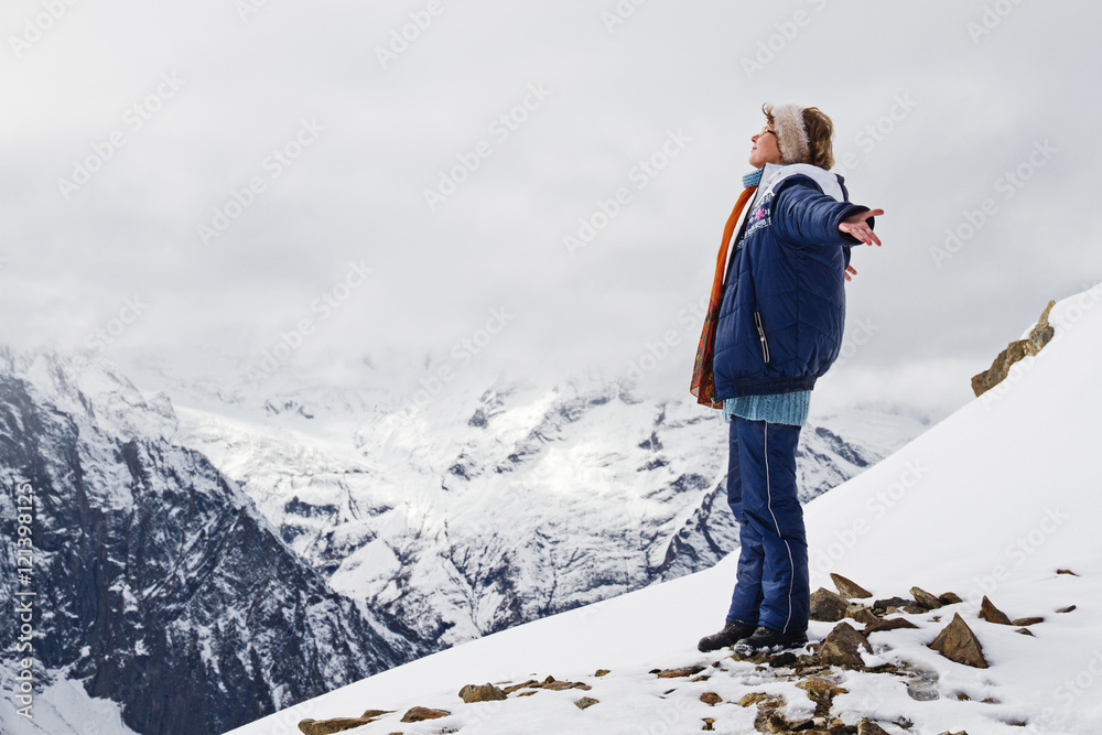 Girl top mountains snow