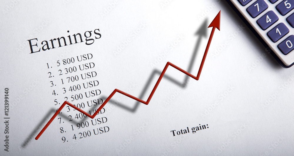 table with earnings with digits, calculator and diagram table with earnings with digits, calculator and diagram