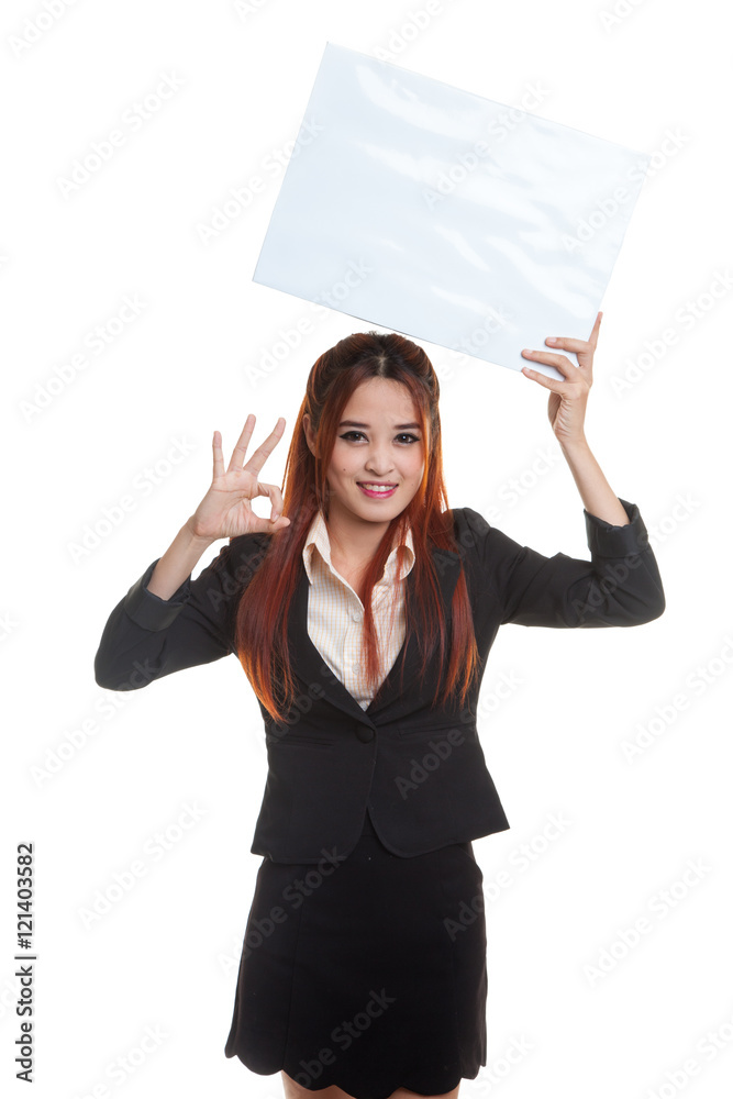 Young Asian business woman show OK with  white blank sign.