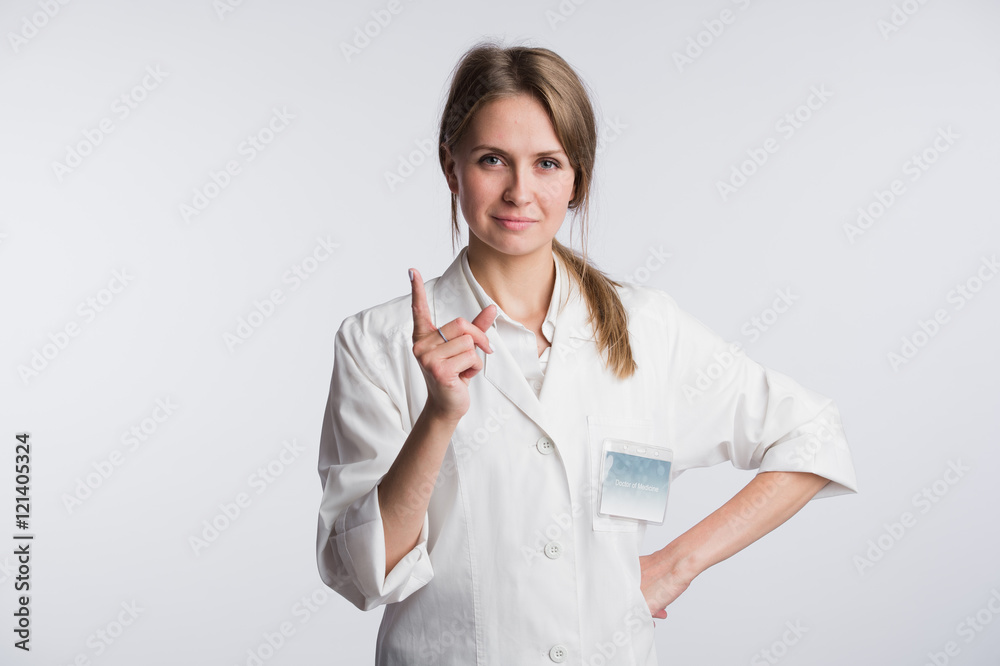 Young doctor woman nurse presenting and showing copy space for product or text. Caucasian female medical professional isolated on white background. Young doctor woman nurse presenting and showing copy space for product or text. Caucasian female medical professional isolated on white background.