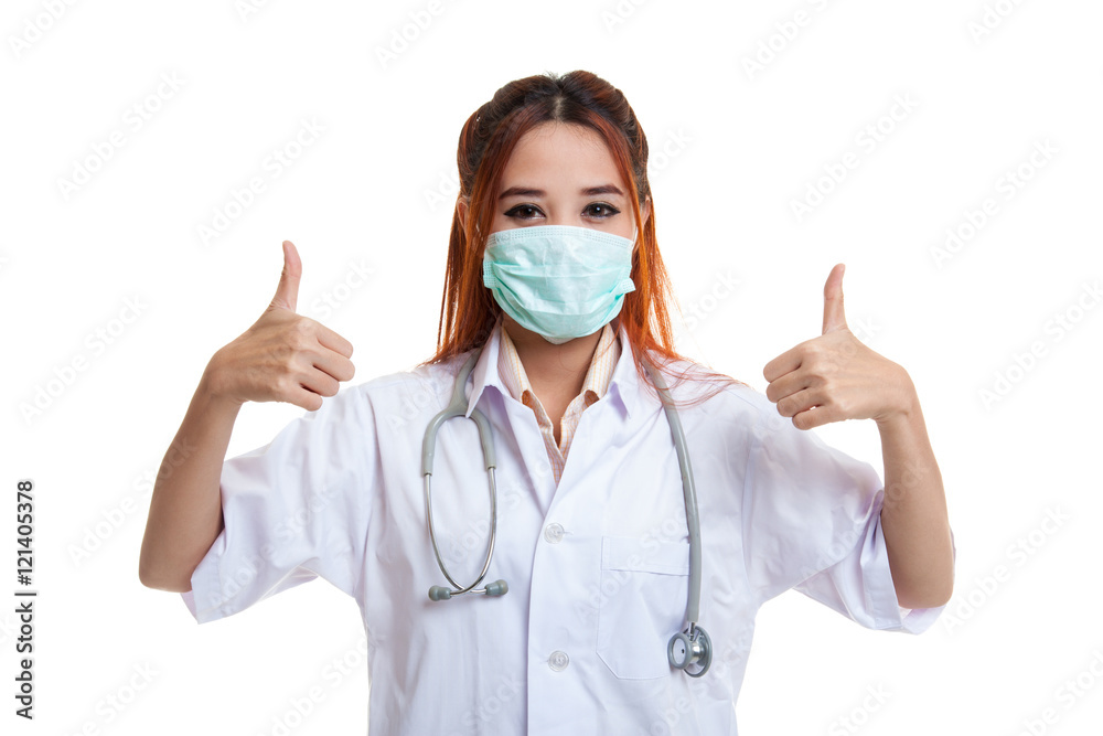 Young Asian female doctor thumbs up with both hands. Young Asian female doctor thumbs up with both hands.