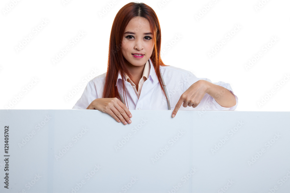Young Asian female doctor point down to blank sign. Young Asian female doctor point down to blank sign.