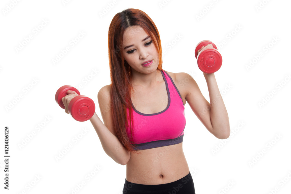 Tired Asian healthy girl exercise with dumbbell. Tired Asian healthy girl exercise with dumbbell.