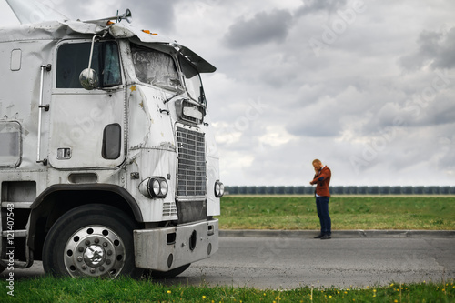 broken truck after the accident in foreground