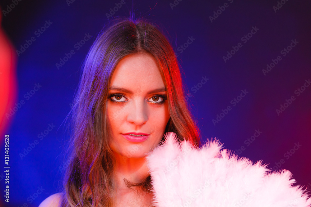 Woman holding carnival feather fan in hand. Woman holding carnival feather fan in hand.