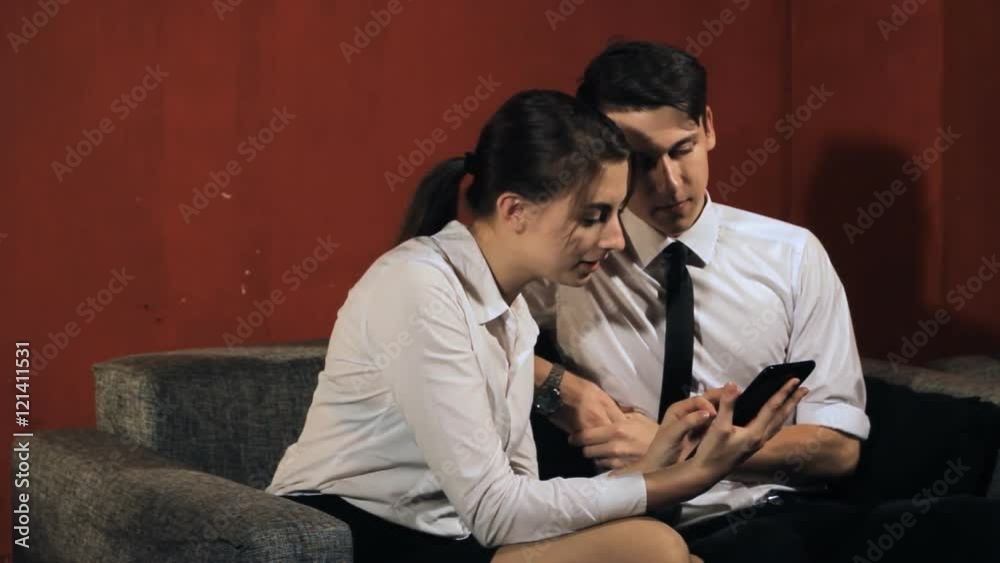 Business woman and businessman talking on the work in the office