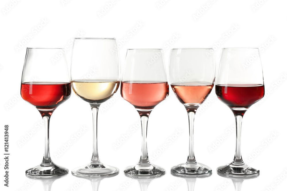 Glasses with different wine in a row, isolated on white