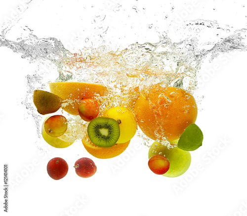 Fruits  falling into water on white background