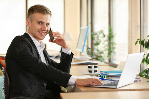 Young man speaking by cellp...