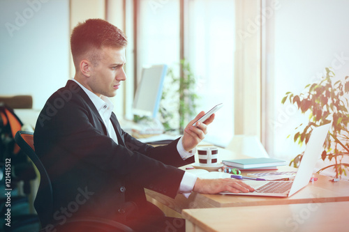 Young man speaking by cellp...