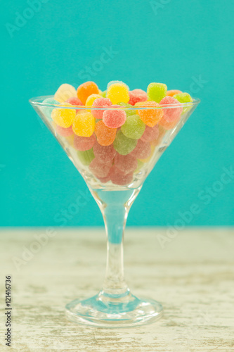 Many candy in glass with blue background