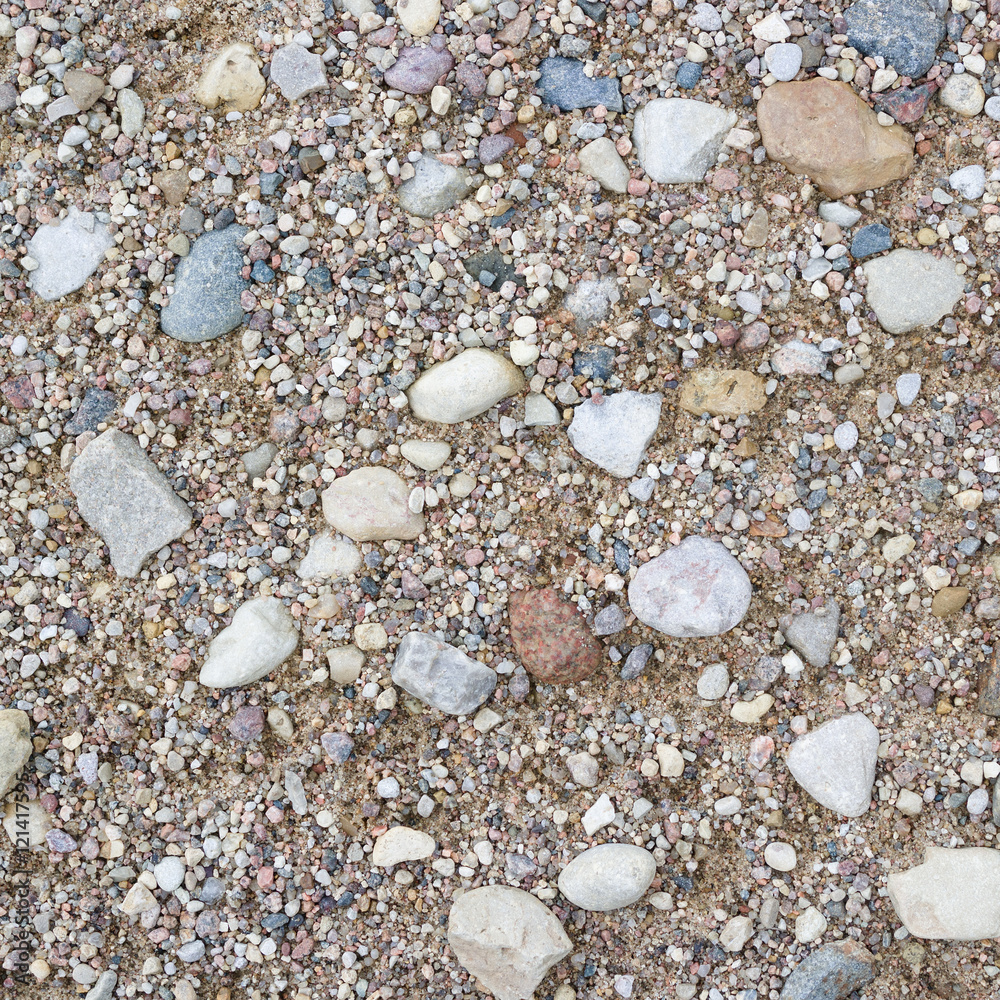 Rural road close-up. Stone and sand texture or background. Rural road close-up. Stone and sand texture or background.