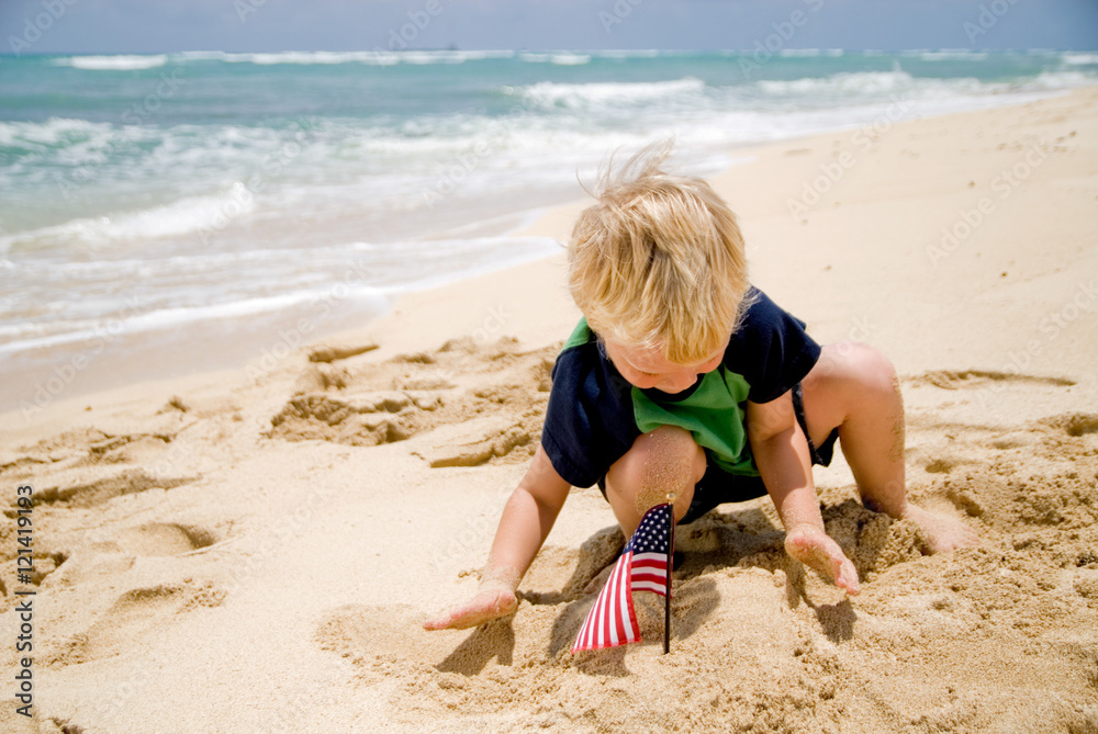 Little boy with an American flag on the beach Little boy with an American flag on the beach