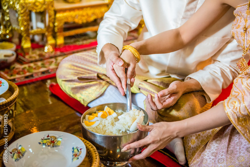 Puts food offerings in Thai wedding ceremony