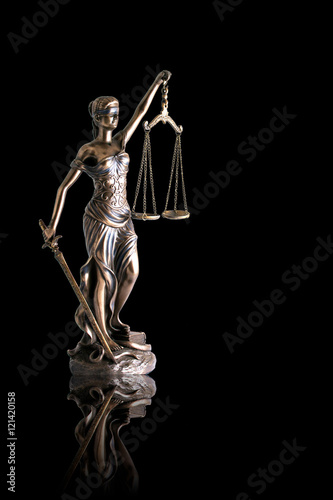 Lady justice or Themis with reflection isolated on black background