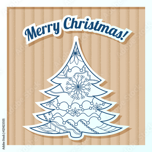 Merry Christmas card on cardboard with tree