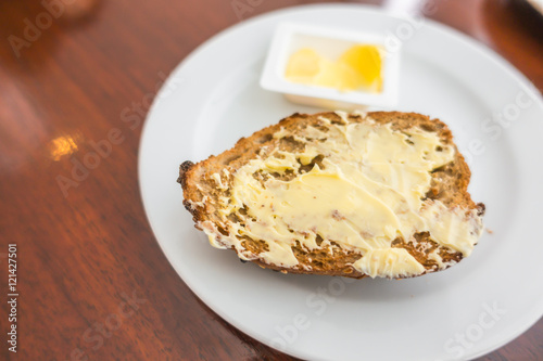 Toast bread in a white plate .